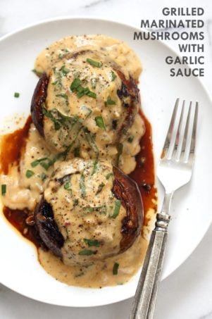 Grilled Portobello Mushrooms with Garlic Sauce. Grilled or Baked Marinated Portabella Mushrooms served with creamy gravy. #Vegan #Glutenfree #Recipeย #veganricha | VeganRicha.com