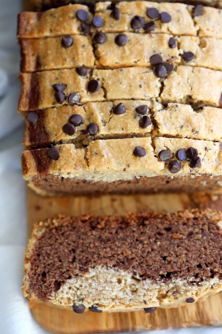 Gluten-free Cashew Butter Chocolate Marble Cake on a wooden board