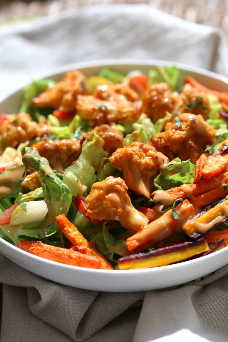 Peanut Butter Cauliflower Bowl with Roasted Carrots. Cauliflower tossed in peanut butter sauce and roasted, carrots tossed in hot sauce and roasted. Vegan Recipe, Gluten-free Recipe.  | VeganRicha.com