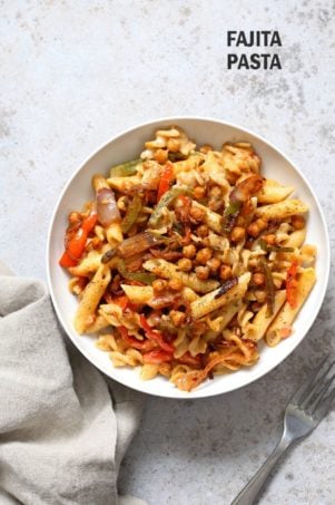 Vegan Fajita Pasta with Chickpeas and veggies. Easy Weeknight pasta with Taco seasoned veggies and beans mixed with creamy pasta. Vegan Soyfree Recipe. Can be gluten-free.ย #vegan #veganricha