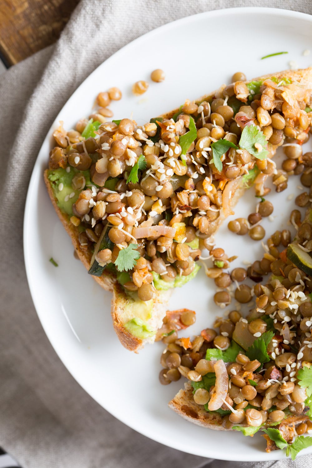 Ginger Coriander Sprouted Lentil Avocado Toast. Sprout Lentils or Mung Beans, Lightly saute with ginger, onion and tomato and serve over Mashed Avocado Toast. #Vegan #veganricha #Nutfree #Soyfree #Recipe | VeganRicha.com