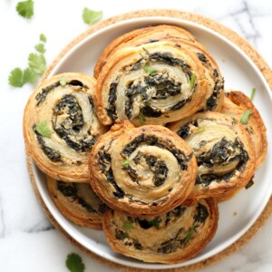 Vegan Spinach Pinwheels. Creamy cheesy Spinach dip spread on puff pastry, rolled, sliced and baked to make a great Snack. #Vegan #Soyfree #Recipe #veganricha | VeganRicha.com
