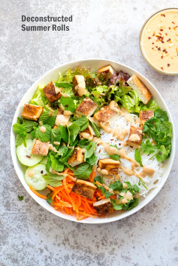 Crunchy Veggie Vegan Summer Rolls Deconstructed into a Bowl. Served with Peanut Butter Dipping Sauce. Fresh Spring Rolls/ Rice paper rolls in a bowl. Make a bowl, wrap or fill up rice paper wrappers. #Vegan #Glutenfree #Recipe #veganricha Use Sunbutter to make #nutfree | VeganRicha.com
