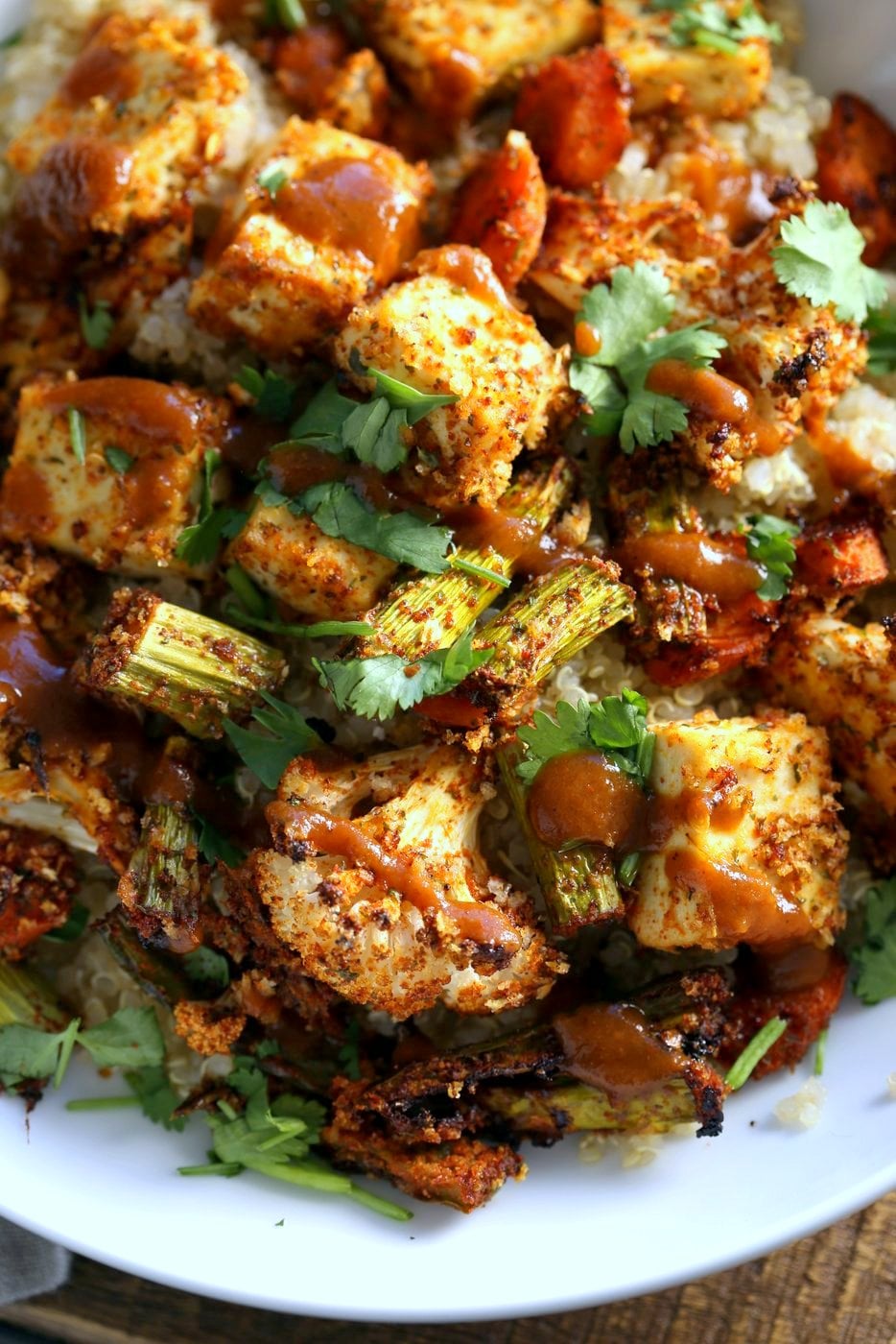 Tofu and Veggie BBQ Bowl. Veggies and Tofu tossed in from scratch barbecue seasoning and baked. Serve over quinoa dressed with bbq sauce. #Vegan #Glutenfree #Nutfree #Recipe #veganricha