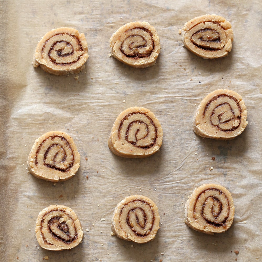 Vegan Cinnamon Roll Cookies. Soft shortbread like cookie dough dusted with cinnamon sugar, rolled, sliced and baked for cinnamon roll bites. #Vegan #Soyfree #VeganRicha #Recipe.
