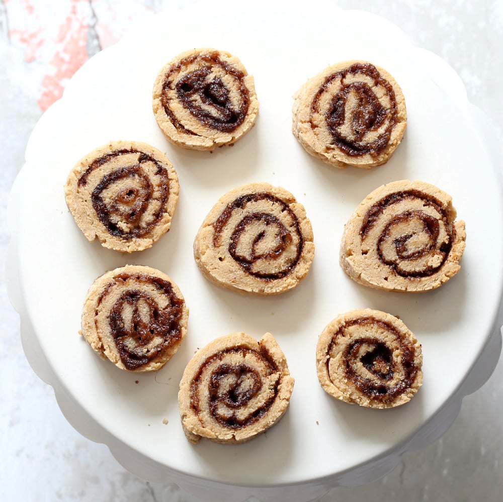 Vegan Cinnamon Roll Cookies. Soft shortbread like cookie dough dusted with cinnamon sugar, rolled, sliced and baked for cinnamon roll bites. #oilfree #Vegan #Soyfree #VeganRicha #Recipe.