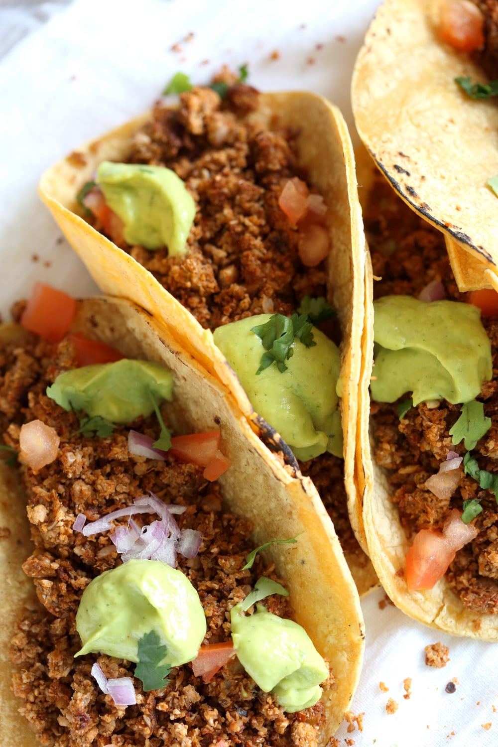 Cauliflower Taco Meat filled in Corn tortillas over White Napkin