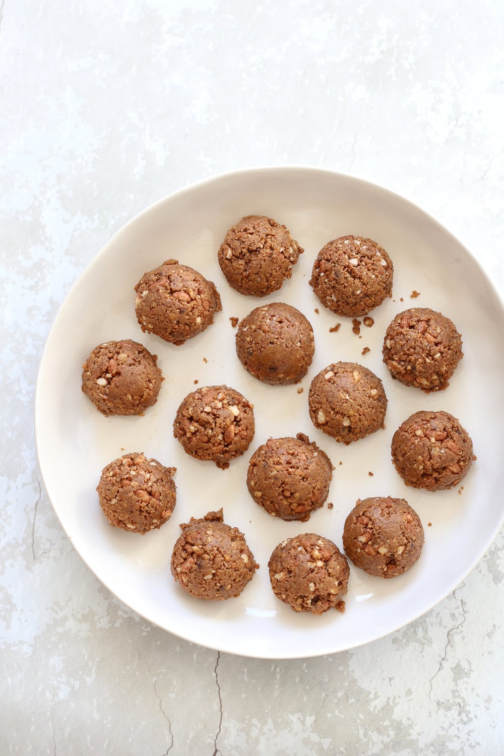 Our Peanut butter balls with Rice Krispies or Oats in a White Bowl