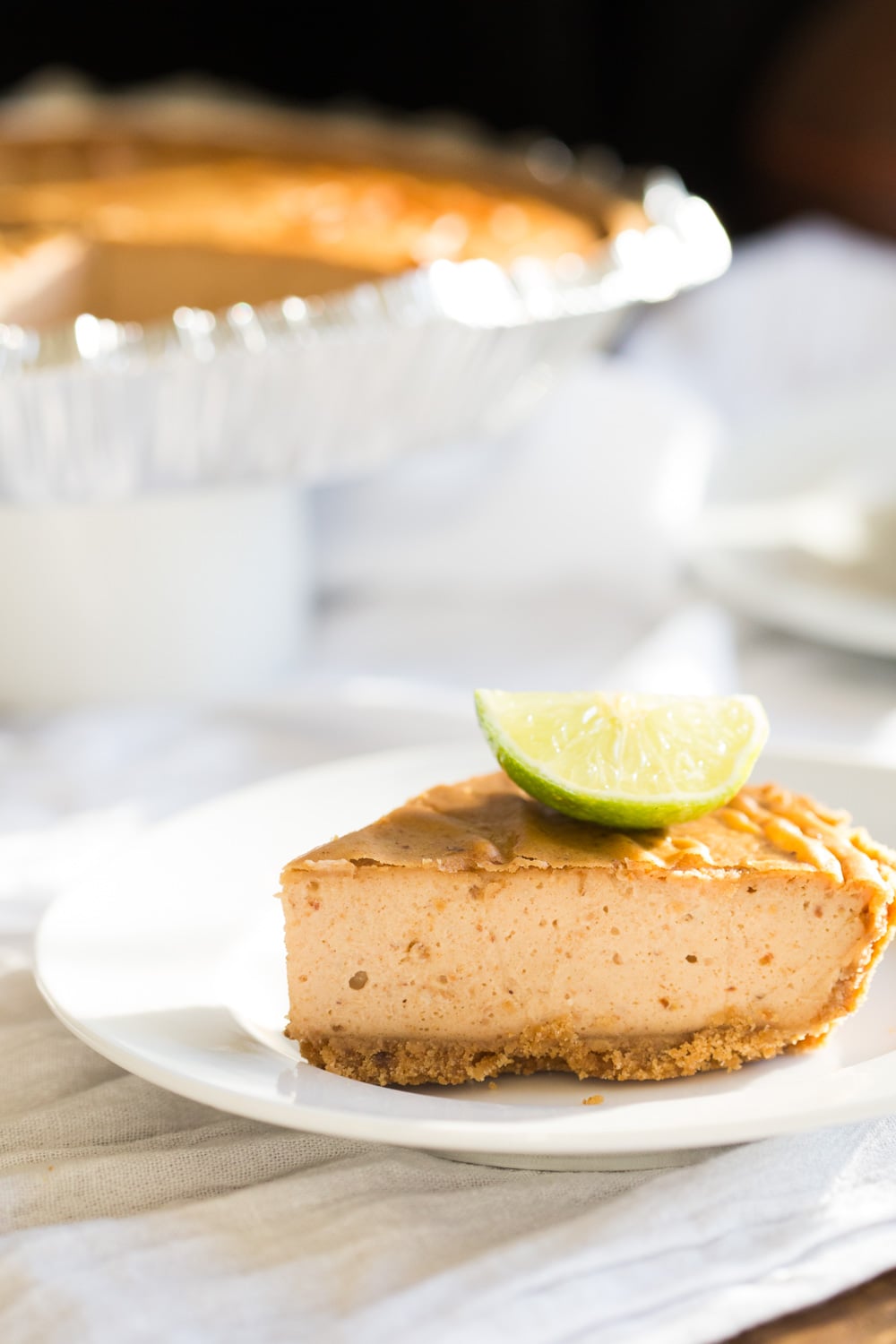Baked Vegan Cheesecake slice on a white plate