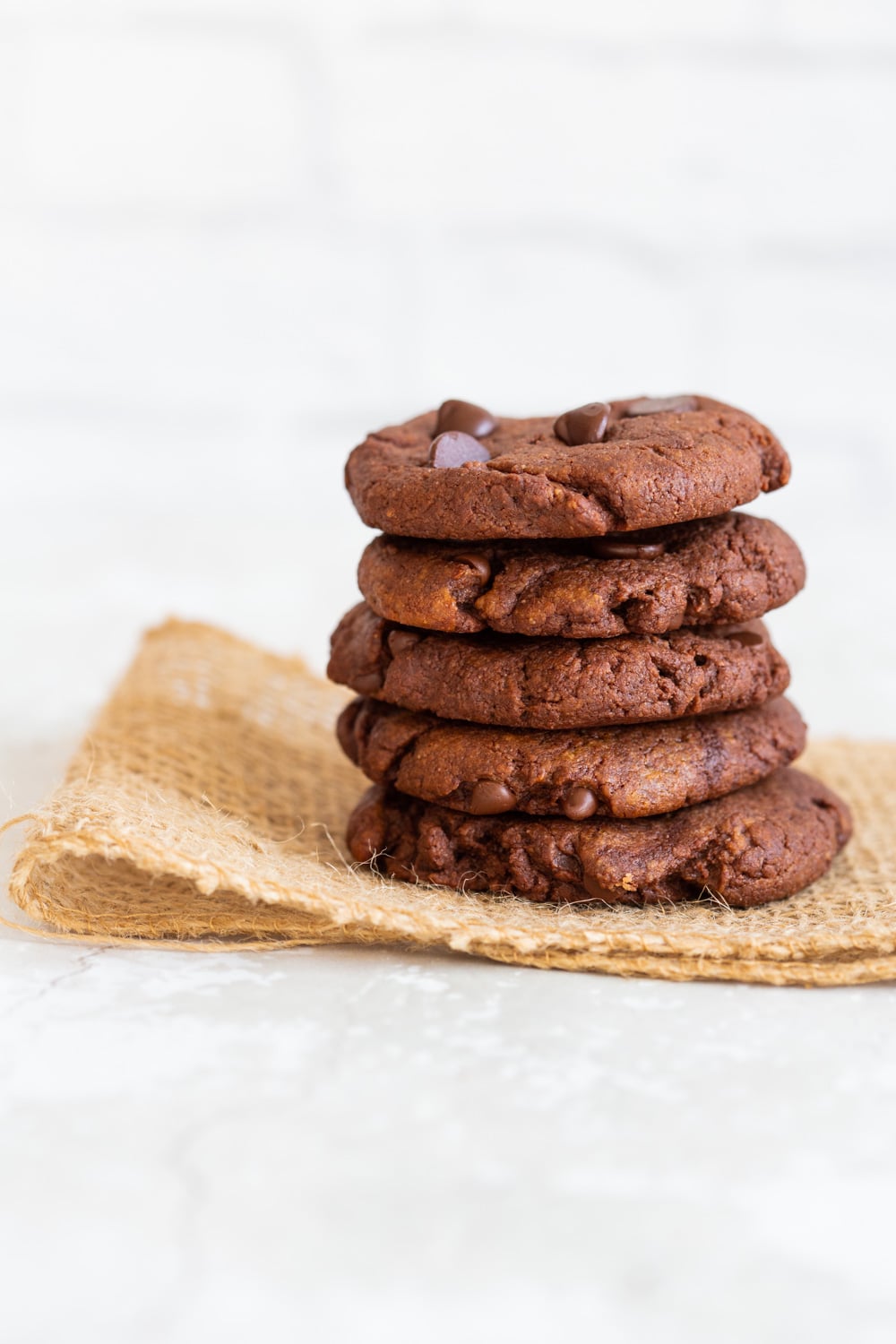 Grainfree Vegan Chocolate Tahini Cookies on parchment lined baking tray