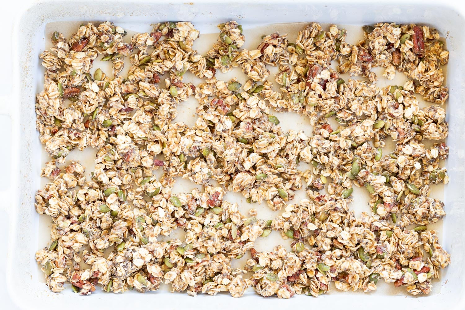 This Date Caramel Maple Pecan Granola is lightly sweet and perfect for any time. Pecans, Oats, coconut, pumpkin and chia seeds and dried blueberries tossed in date caramel and baked to perfection. #Vegan #Granola #Glutenfree #Soyfree #Recipe #VeganRicha Can be nutfree.