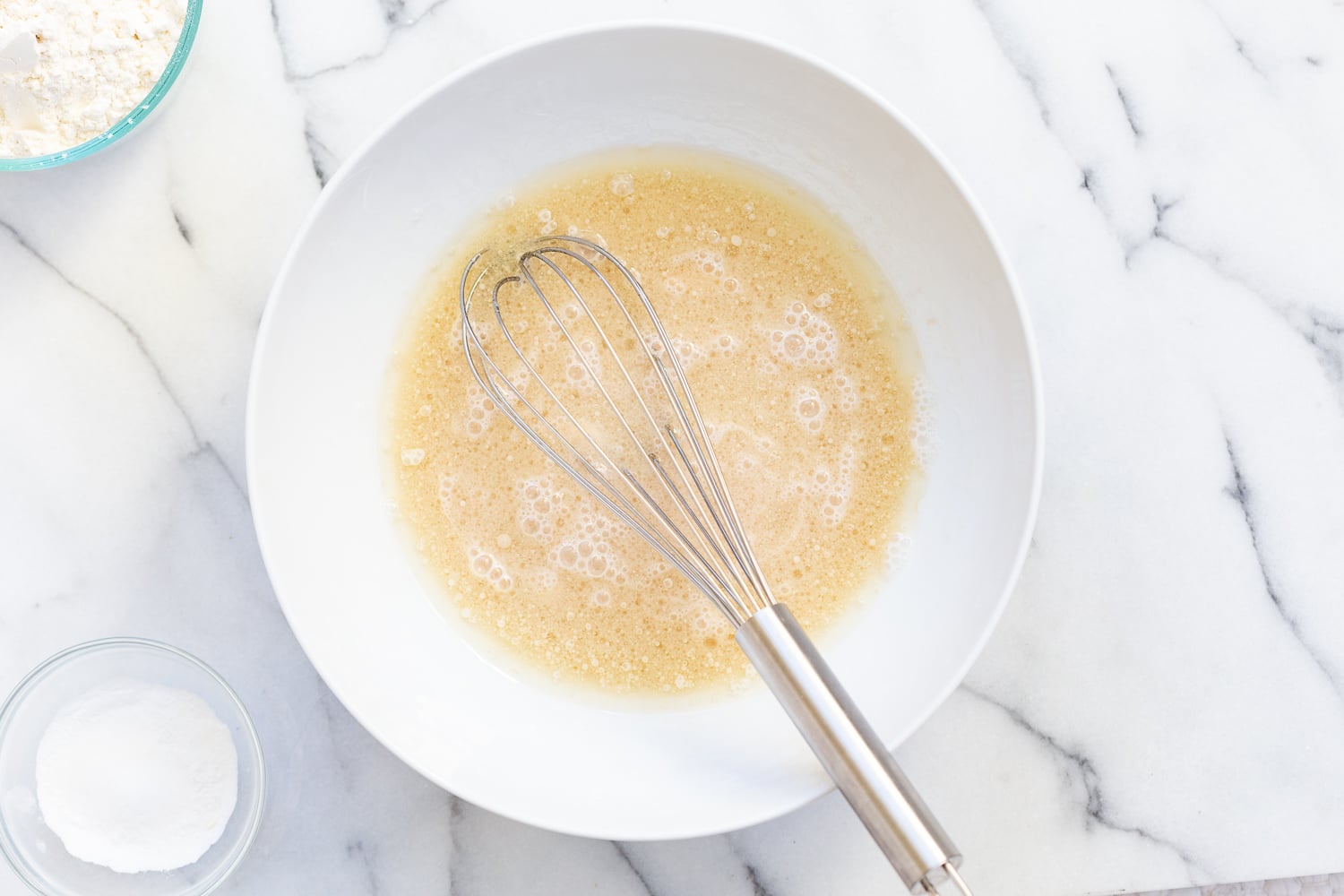 Cake batter for Our Vegan Pear Upside Down Cake in a white bowl