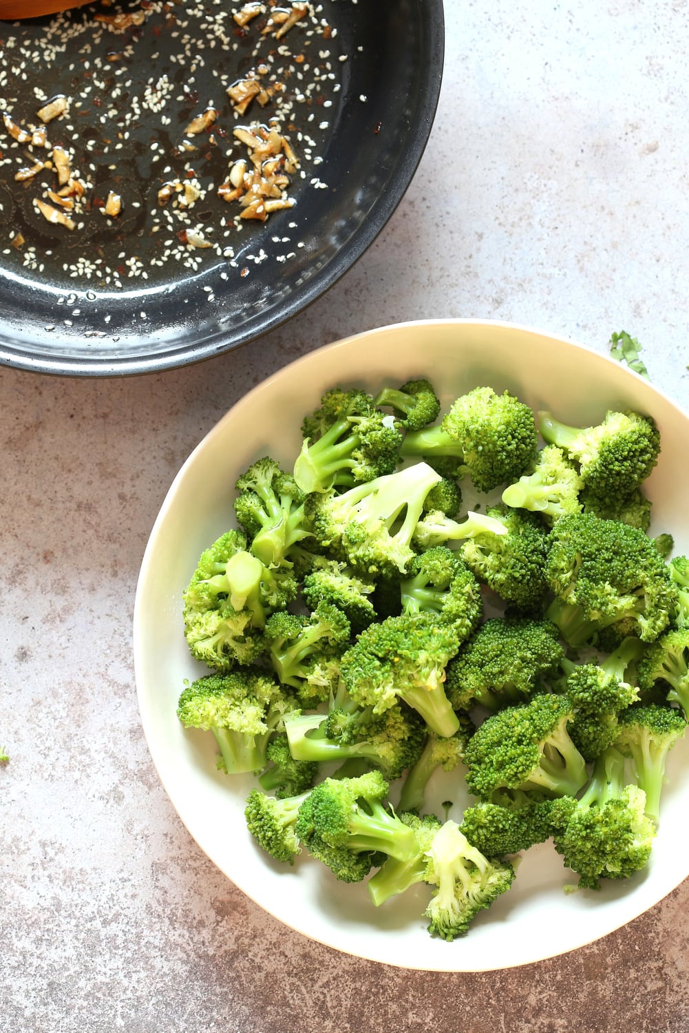 Sesame Garlic Broccoli needs just 6 ingredients. It is vibrant with blanched broccoli and delicious with a simple dressing of garlic roasted with sesame oil. A perfect side. #Vegan #glutenfree #soyfree #nutfree #veganricha #recipeĀ