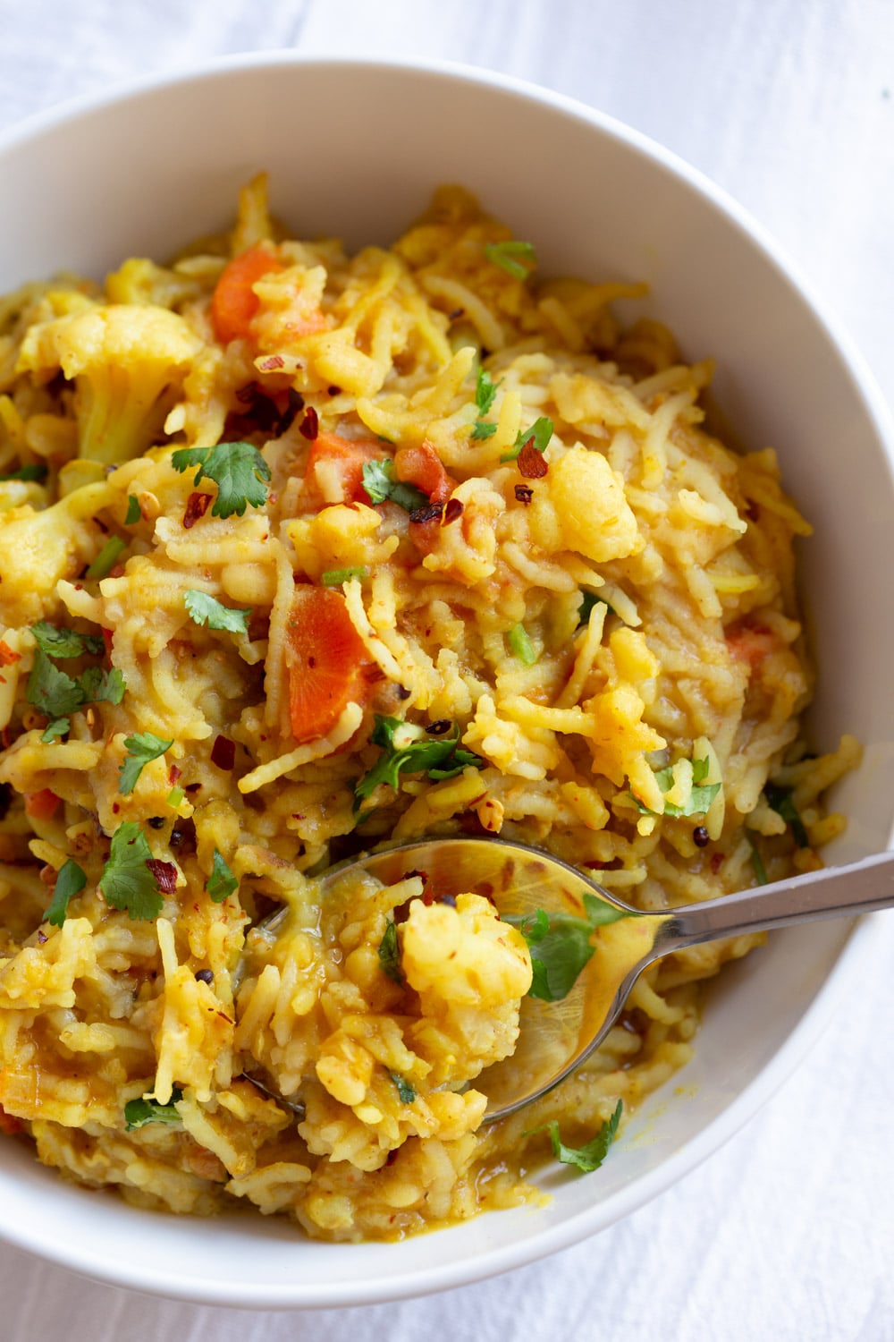 Instant Pot Kitchari a bowl of Instant Pot Kitchari with a spoon