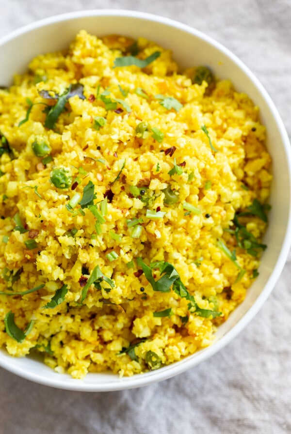 Lemonyย Turmeric Cauliflower Rice. Easy Side with any meal. 1 Pot Lemon Cauliflower Rice with mustard seeds and garlic. #Vegan #Glutenfree #Grainfree #Nutfree #Recipe #Turmeric #cauliflowerrice #veganrucha