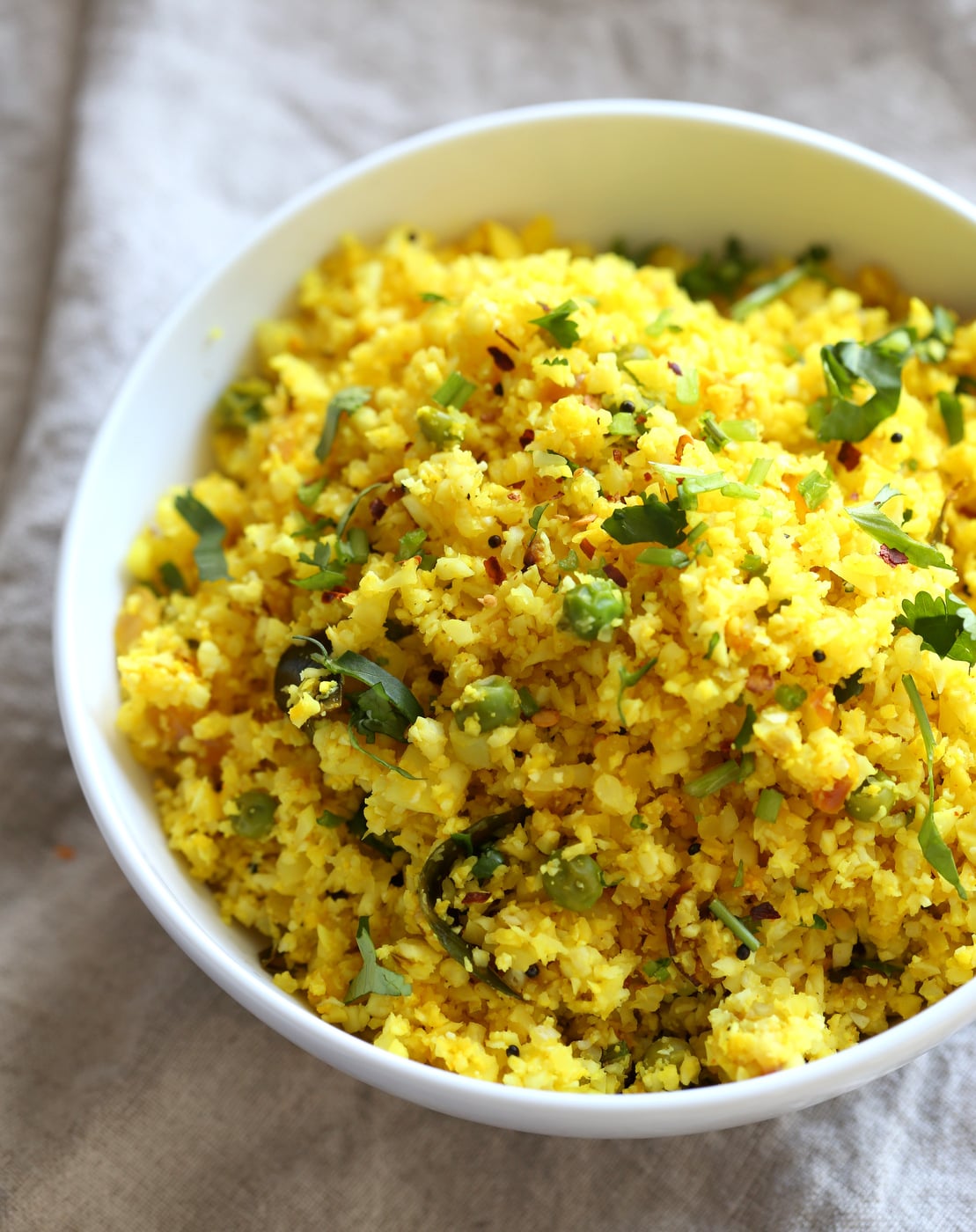 Lemonyย Turmeric Cauliflower Rice. Easy Side with any meal. 1 Pot Lemon Cauliflower Rice with mustard seeds and garlic. #Vegan #Glutenfree #Grainfree #Nutfree #Recipe #Turmeric #cauliflowerrice #veganrucha
