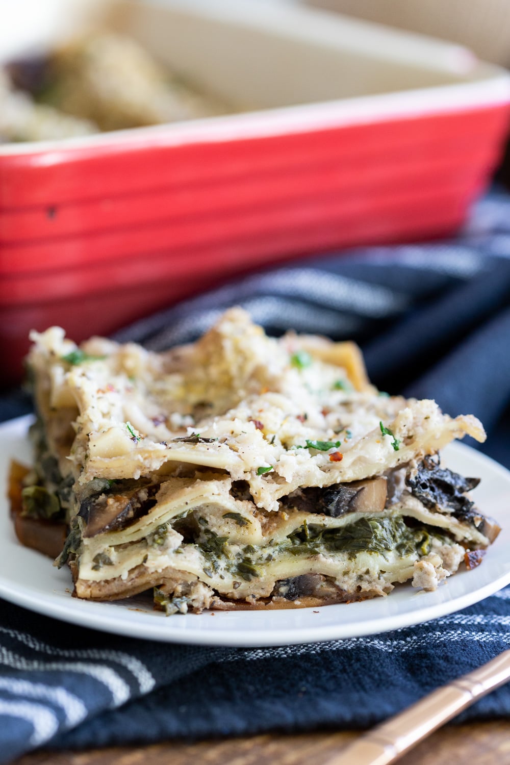 Our Creamy Vegan Mushroom Lasagna slice on a white plate