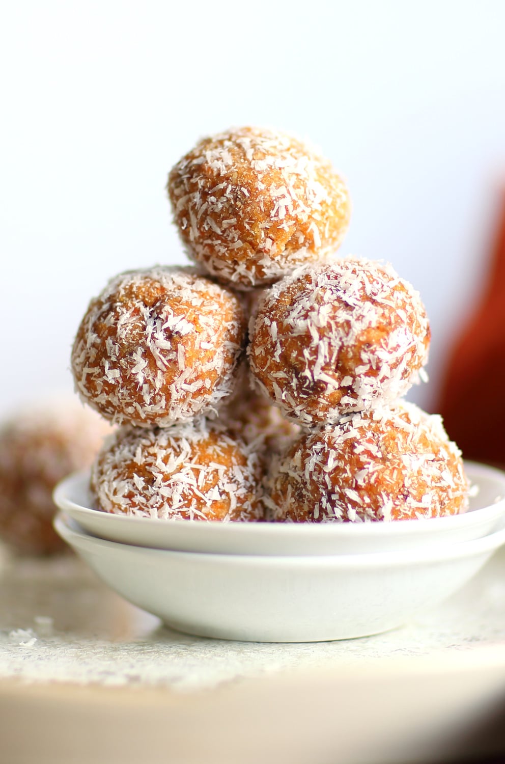 Easy Vegan Carrot Cake Bites Recipe! These Spiced Nut and Carrot Cake Balls Need just 8 ingredients and 15 minutes. Grainfree Carrot Cake Bliss Balls. Roll in coconut or dress with vegan cream cheese glaze. Raw option #refinedsugarfree #refinedoilfree #CarrotCakeBites #Vegan #Glutenfree #Grainfree #Soyfree #healthy #VeganRicha