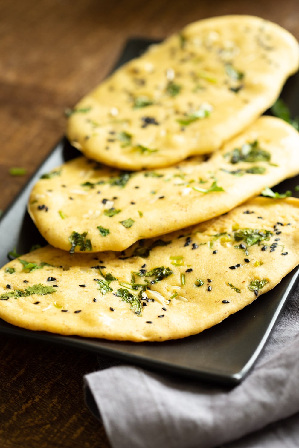 Our Vegan Gluten Free Naan Breads on a Black serving board