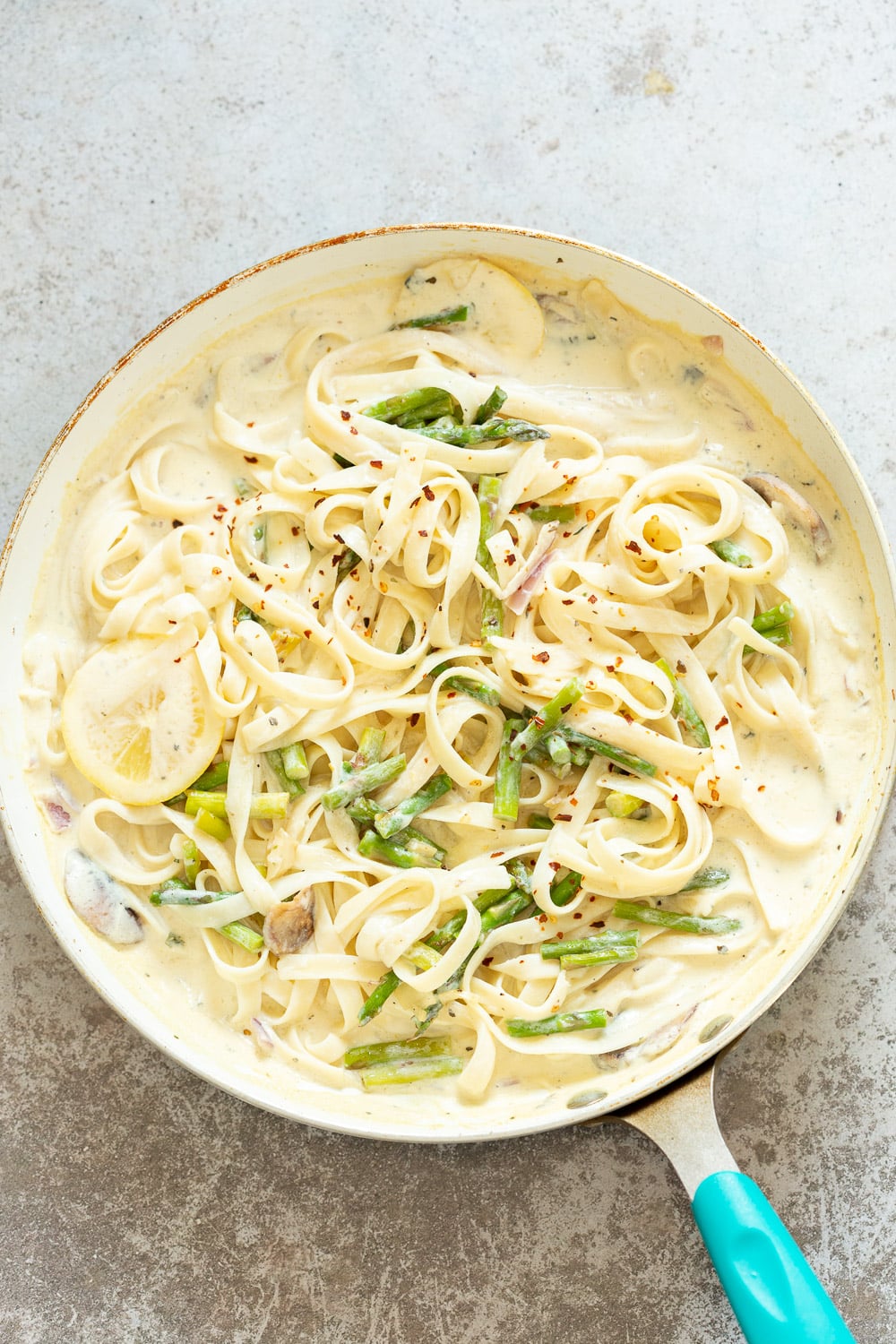 Pasta tossed with Lemon Cream Sauce for our Vegan Lemon Asparagus Pasta