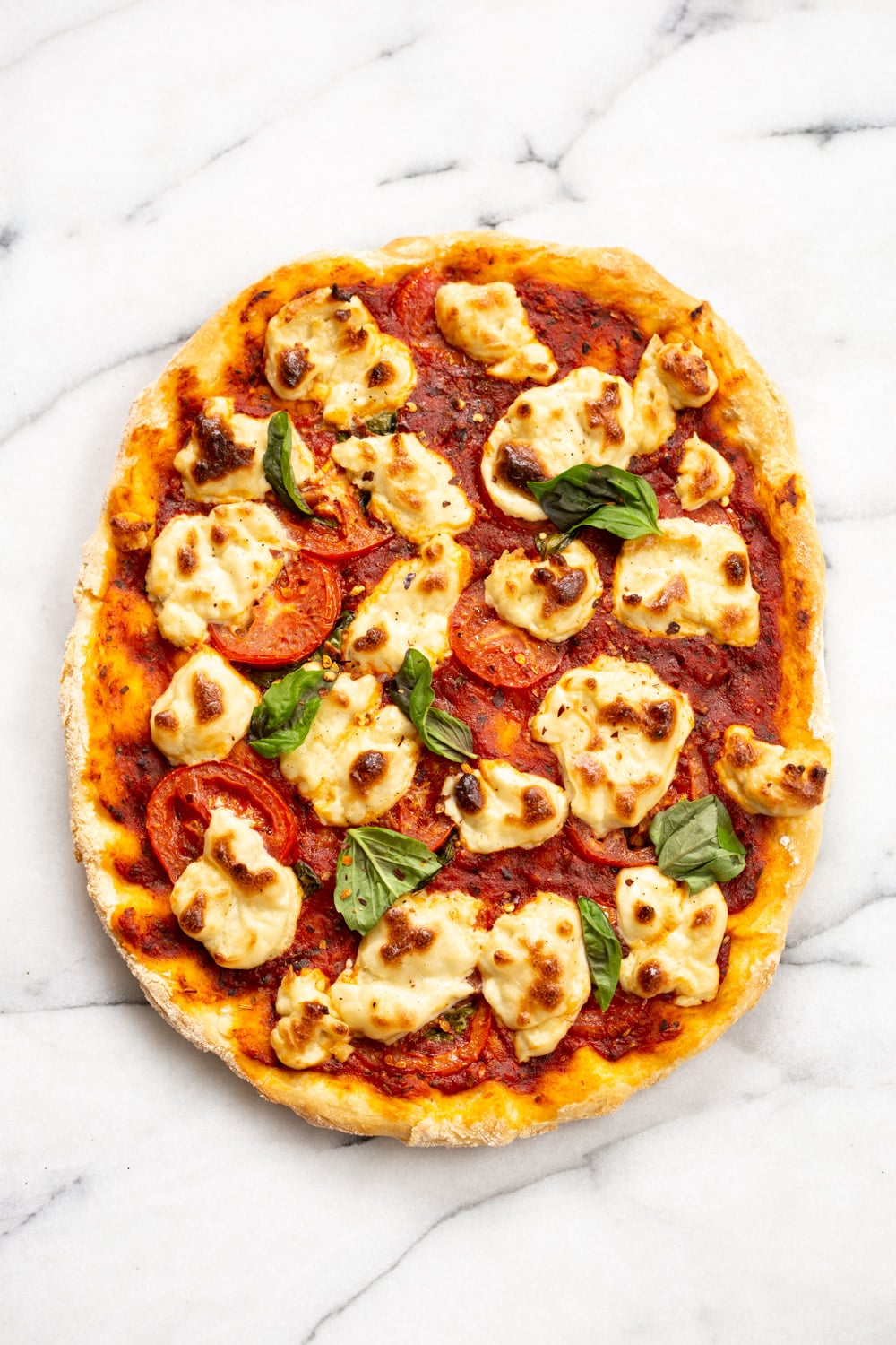 Our Vegan Margherita Pizza on marble