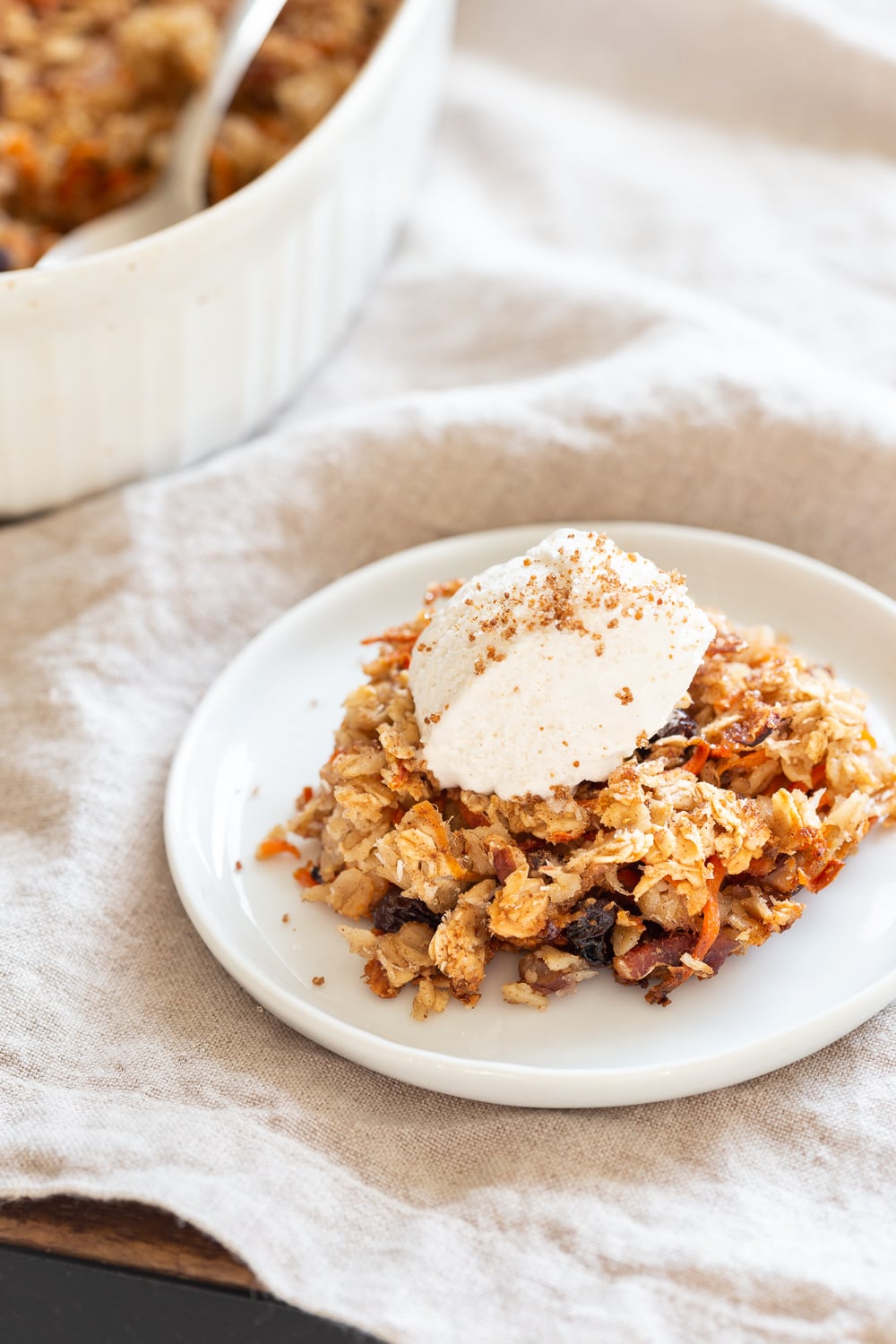 This Vegan Carrot Cake Baked Oatmeal has roasted carrots,, spices, nuts, dates and Oats! Crisp on the outside and spiced, delicious carrot cake like inside. #Vegan #Soyfree #Recipe #Oilfree #VeganRicha #carrotcakeoatmeal #carrotcakebakedoatmeal Easily nutfree, #glutenfree