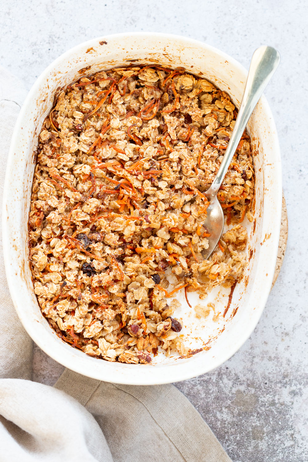 This Vegan Carrot Cake Baked Oatmeal has roasted carrots,, spices, nuts, dates and Oats! Crisp on the outside and spiced, delicious carrot cake like inside. #Vegan #Soyfree #Recipe #VeganRicha #carrotcakeoatmeal #carrotcakebakedoatmeal Easily nutfree, #glutenfree