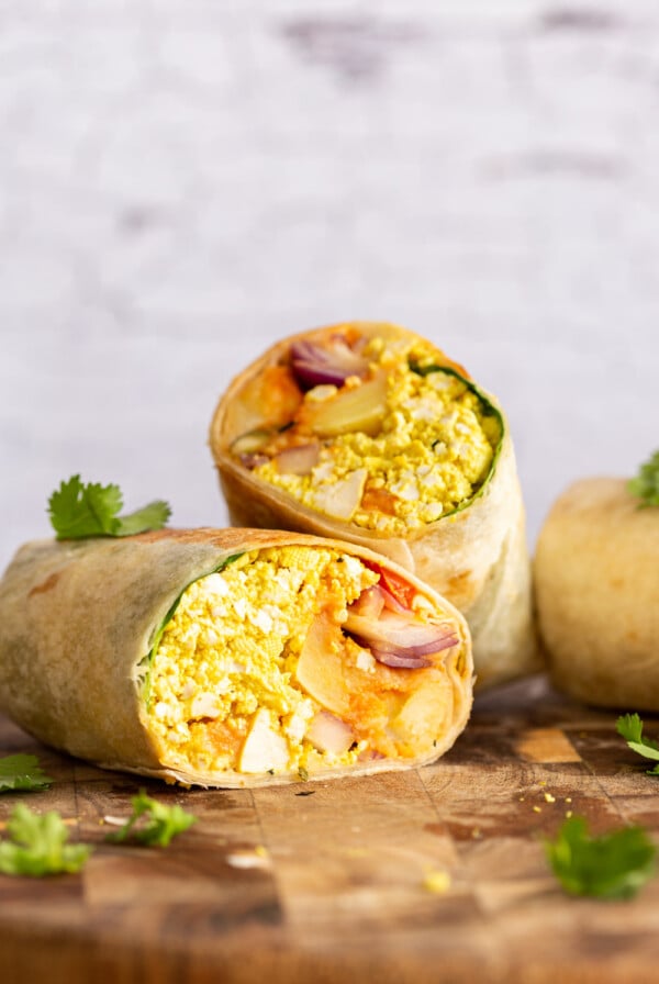Vegan Breakfast Burrito with 5 Ingredient Tofu Scramble, Breakfast potatoes, chickpea pancake, tomatoes, pepitas and salsa! High protein breakfast burrito or tacos. Nutfree Recipe. Can be Gluten-free, Soyfree.