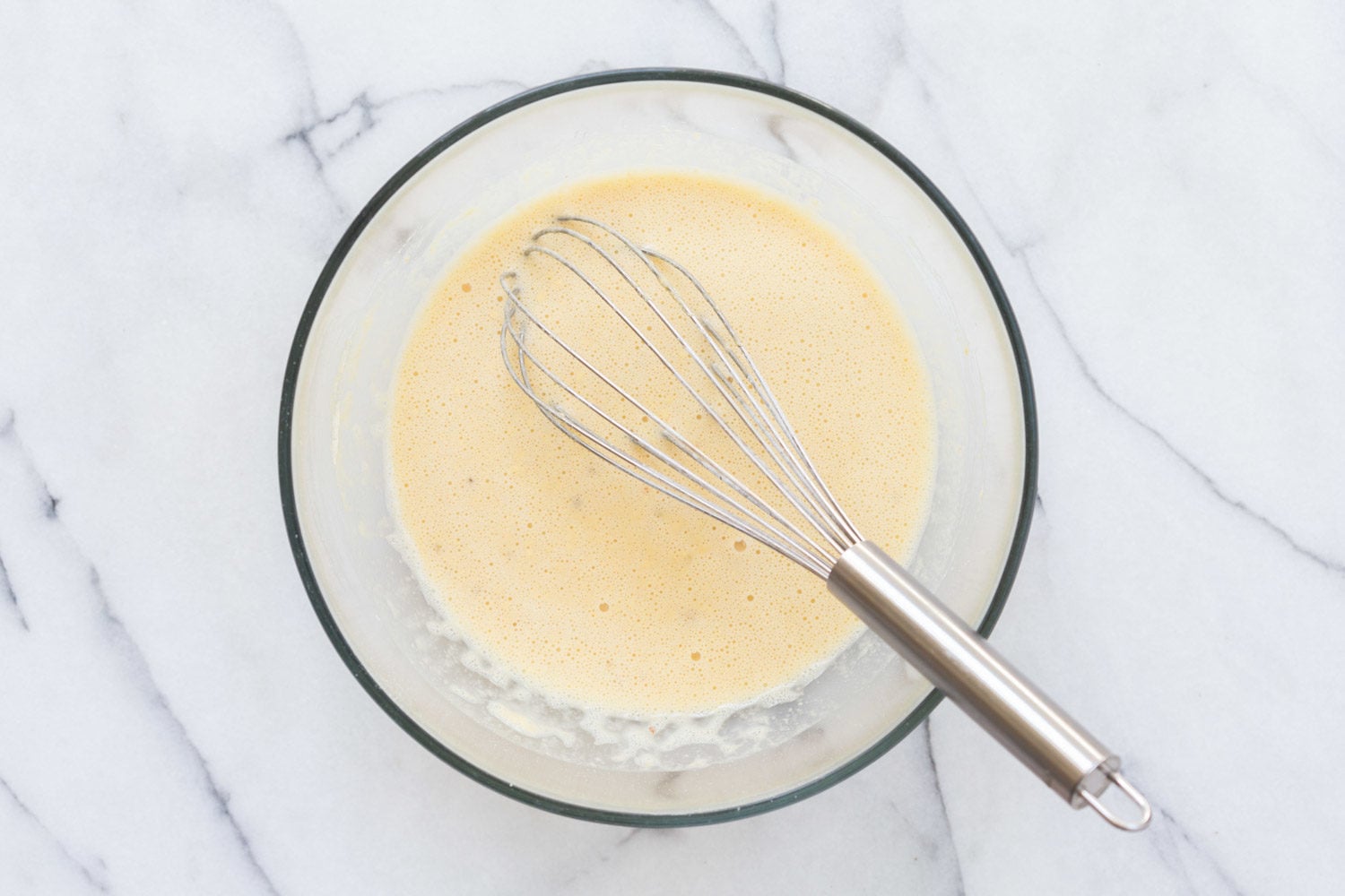 Chickpea Flour Batter in a glass bowl for our Vegan Socca