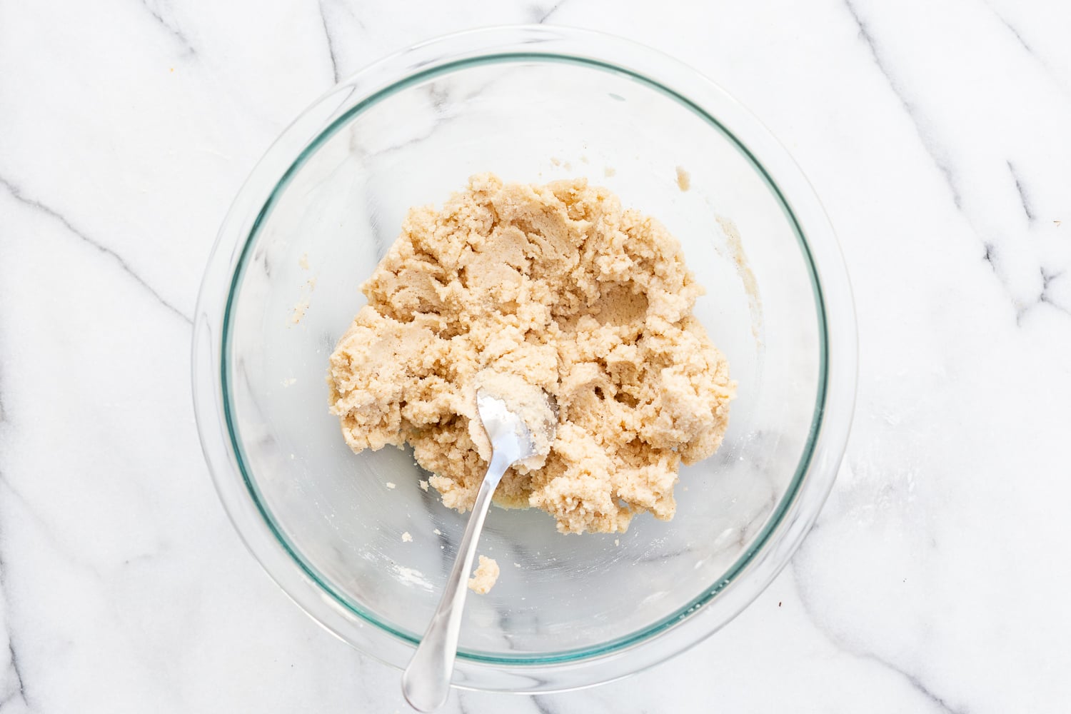 Dough of our Vegan Gluten free Cinnamon Rolls in a glass bowl