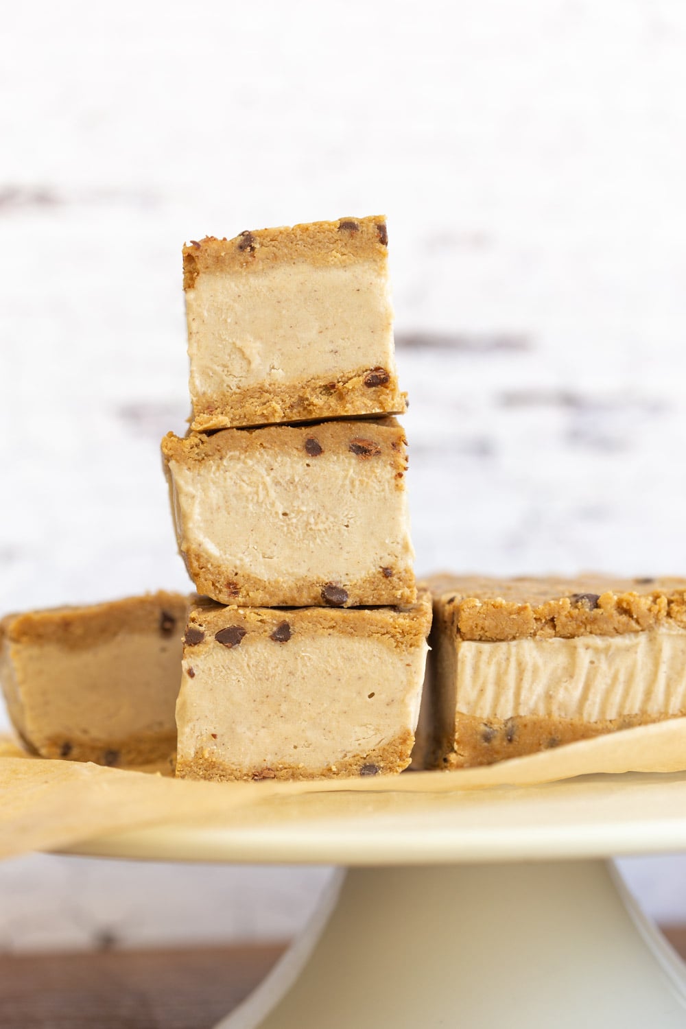 These Vegan Cookie Dough Ice Cream Sandwiches use a quick oat flour cookie dough with coconut milk vanilla ice cream base all homemade. No Baking, no ice cream machine needed. Glutenfree Soyfree Recipe. 