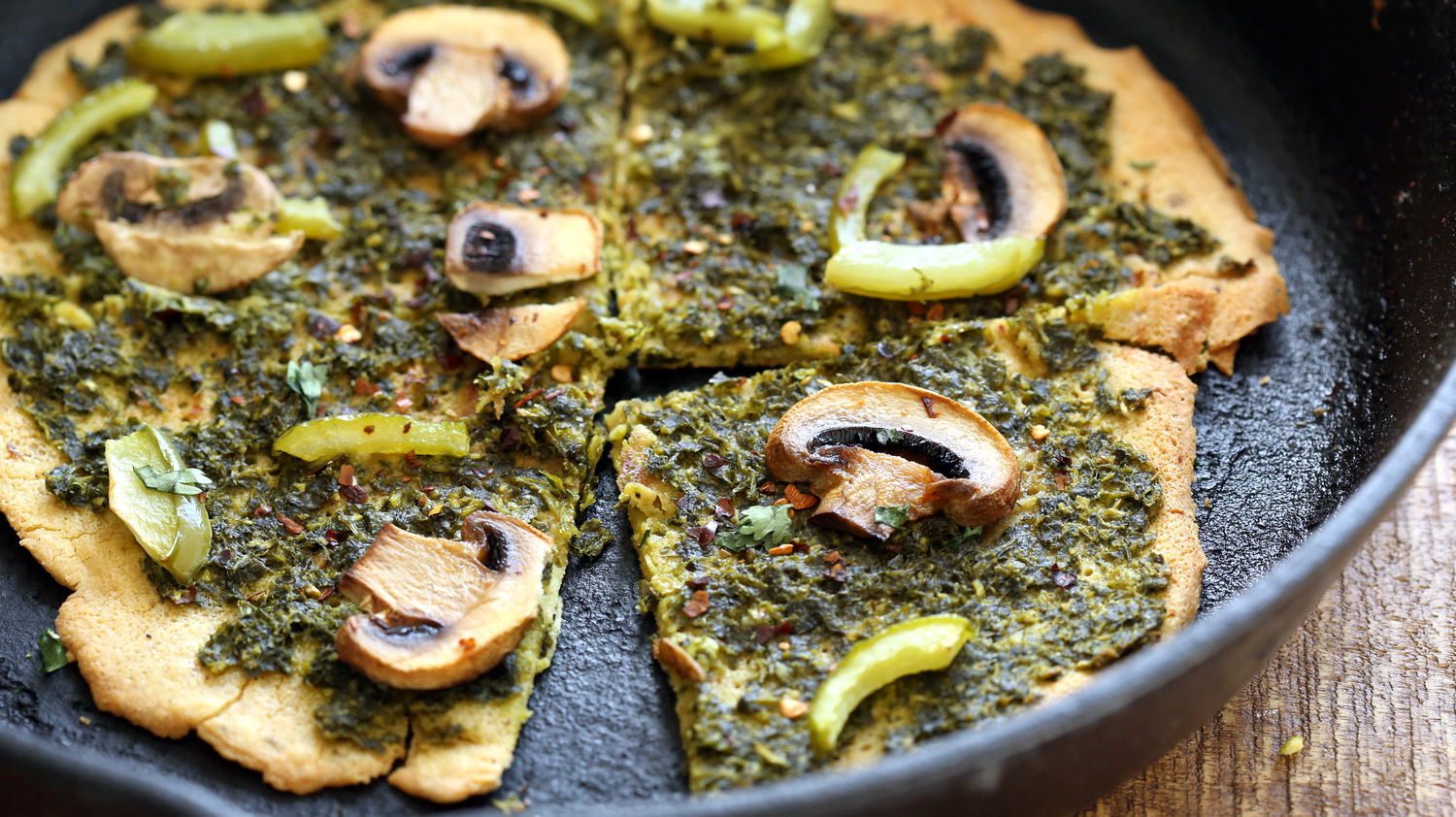 Vegan Socca Pizza with pesto and mushrooms