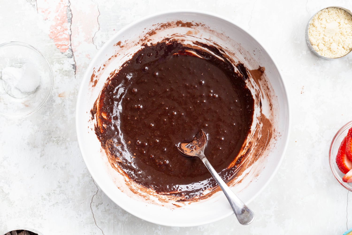 Wet chocolate mixture for our Vegan Strawberry Brownies in a white bowl