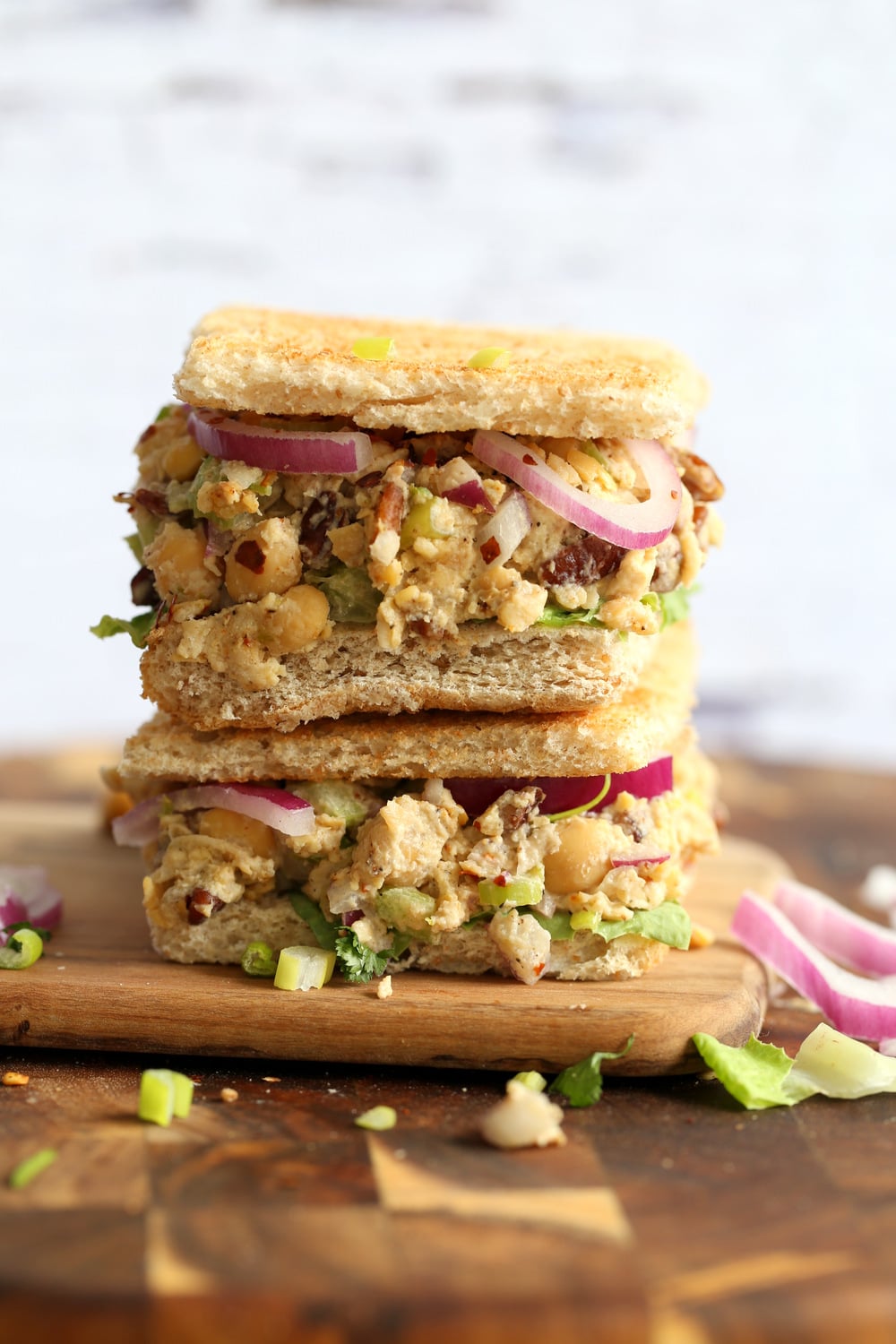 Our Chickpea Tahini Saladi n a Sandwich on wood board