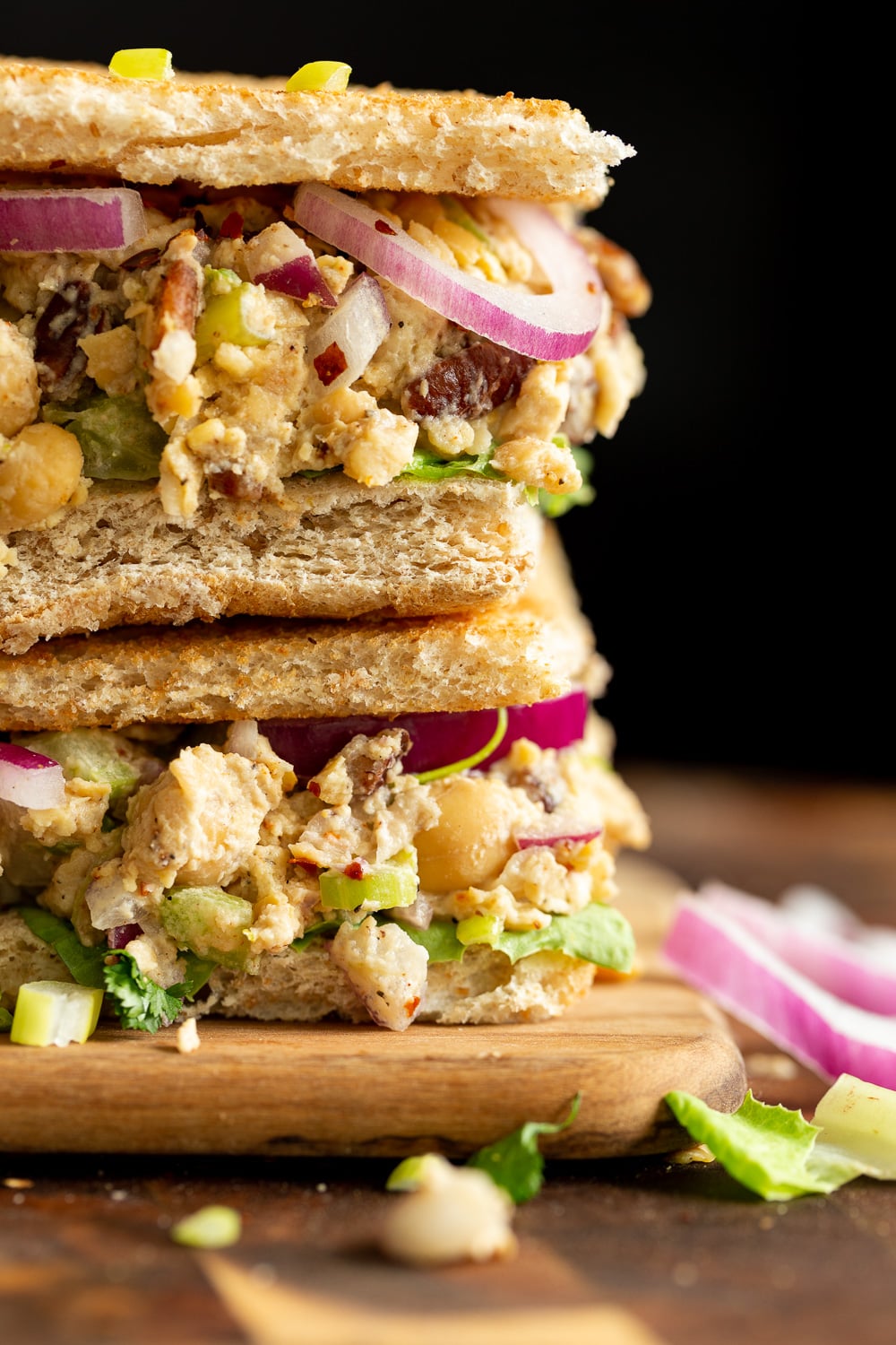 Our Chickpea Tahini Saladi n a Sandwich on wood board