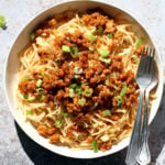 Sesame Noodles with Lemongrass Tempeh Crumbles in a white bowl