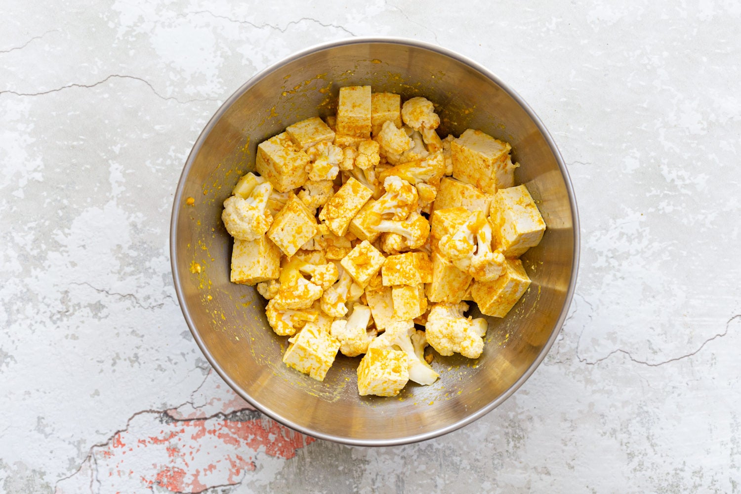Tofu and Cauliflower in a steel bowl