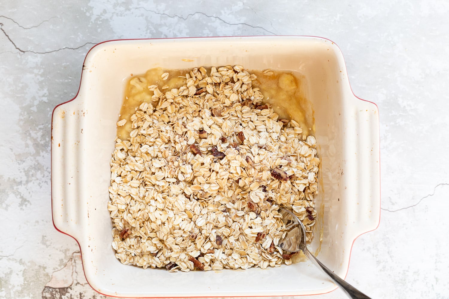 Ingredients for Our Vegan Banana Bread Baked Oatmeal in a white baking dish