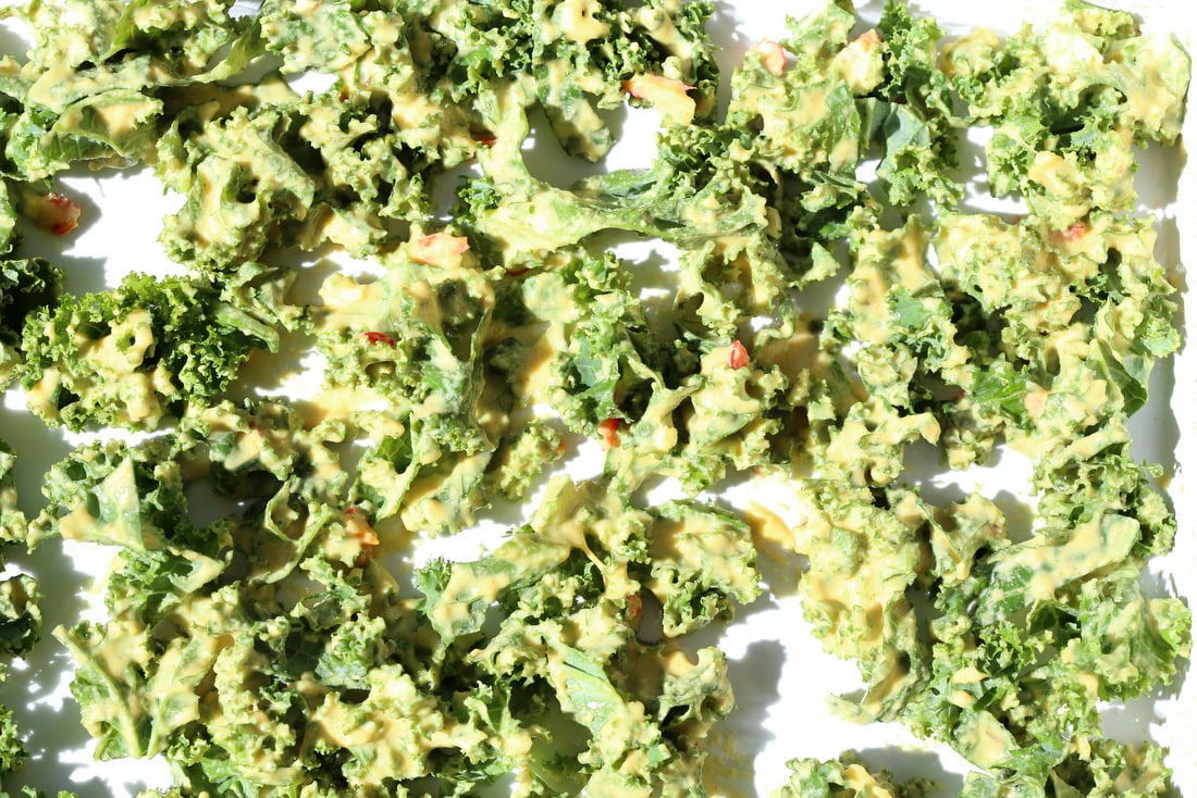 kale pakora in white baking dish