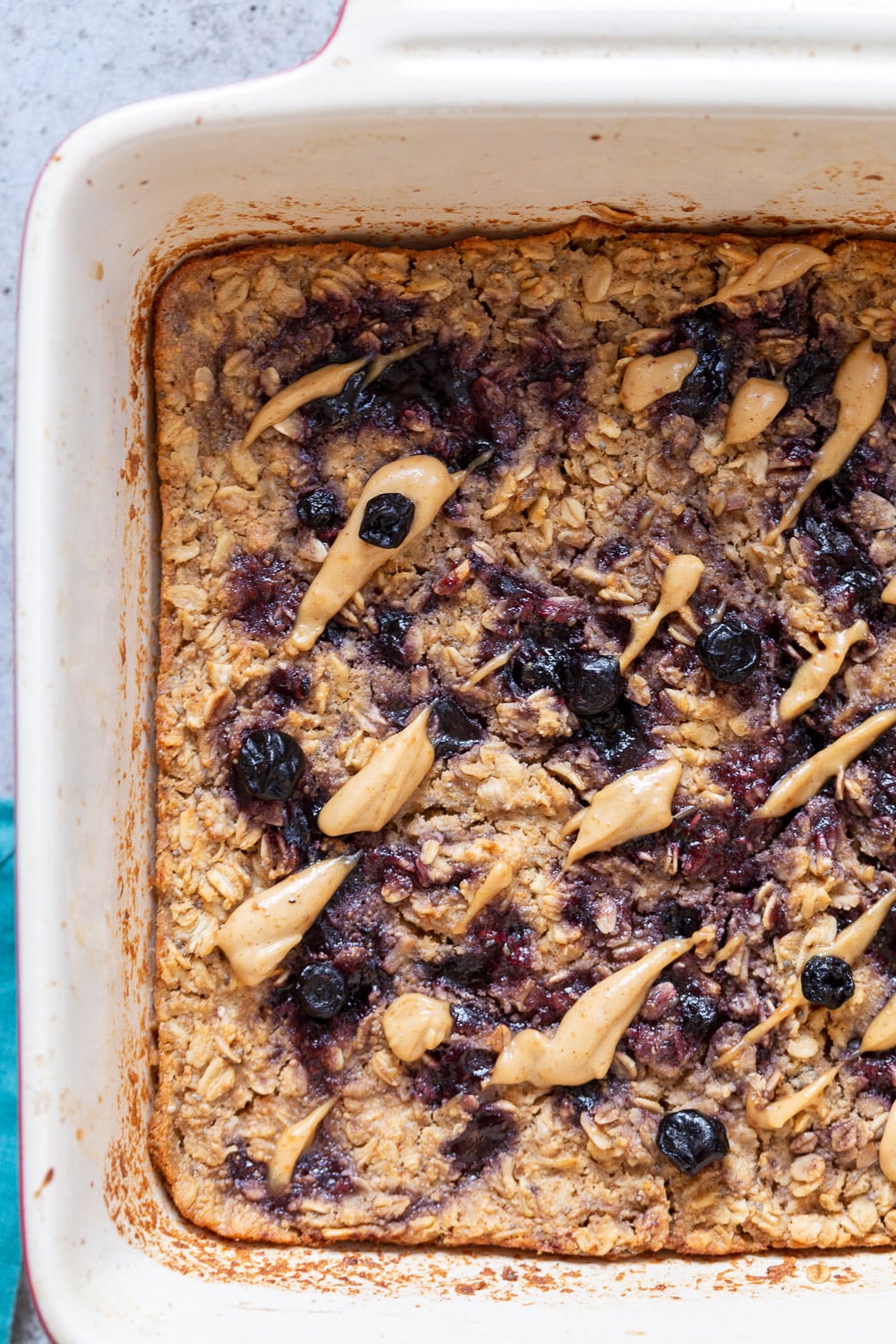 Peanut Butrer And Jelly Oatmeal in a white baking dish