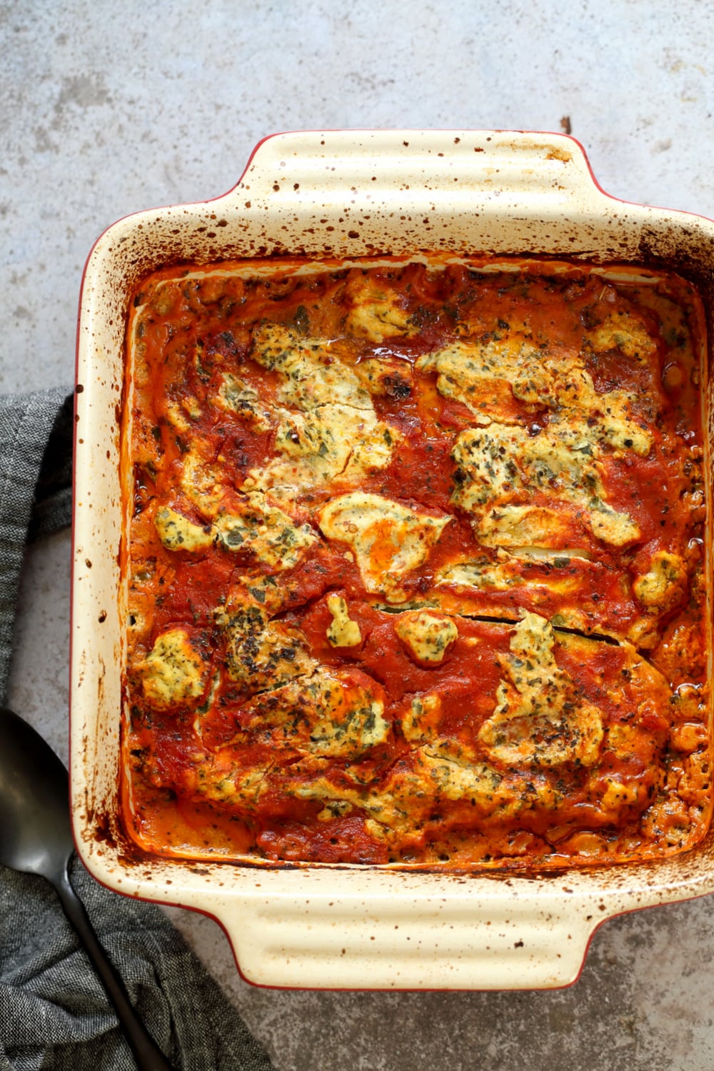 Our Vegan Gluten free Zucchini Lasagna in a cream baking dish