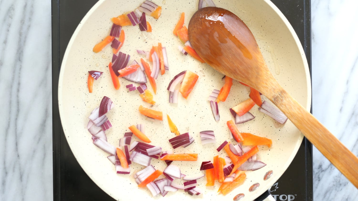 Veggies for Vegan Omelet on a white skillet