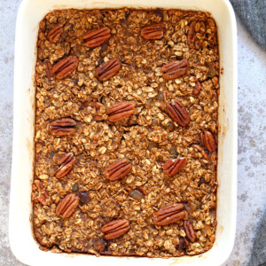 Vegan Gingerbread Baked Oatmeal in a white baking dish