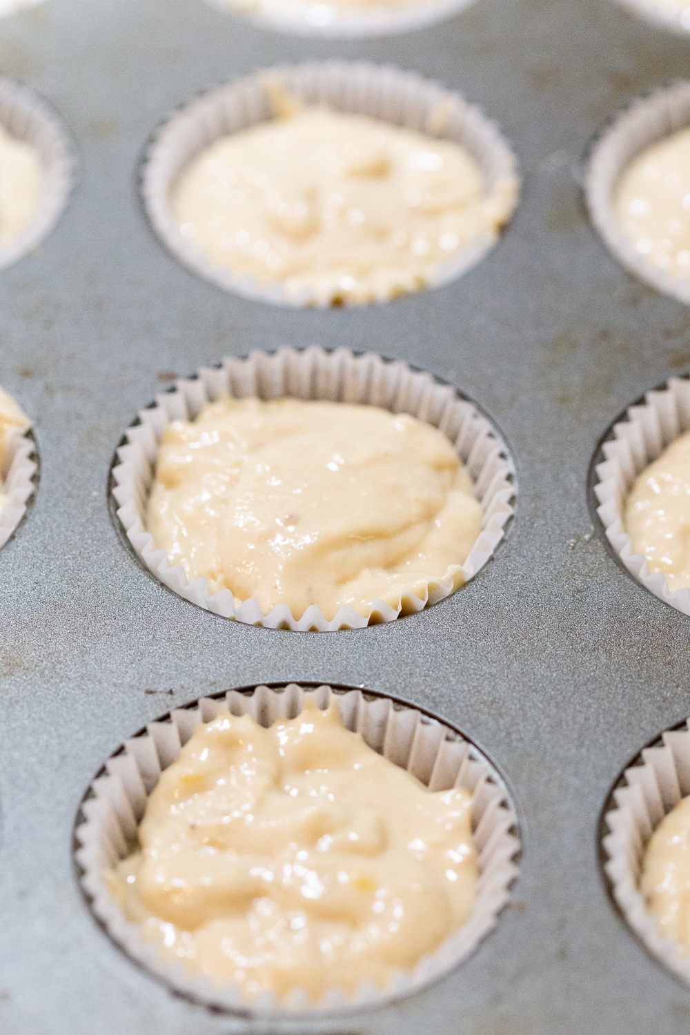 Vegan Banana muffin batter in muffin tin