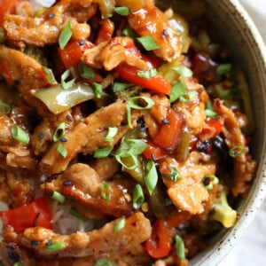 Vegan General Tso Soy curls in a speckled bowl