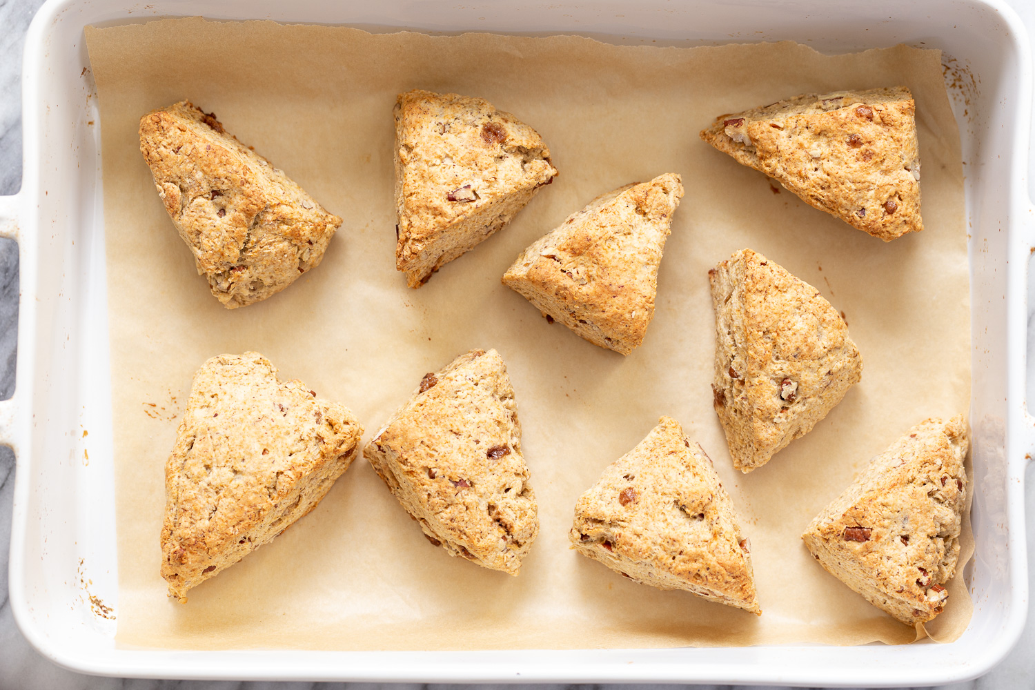 banana scones freshly baked golden brown vegan banana scones on a cookie sheet