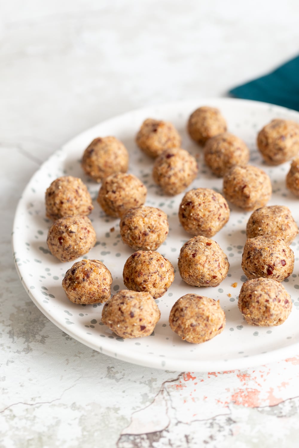 a plate with easy vegan date coconut energy balls 