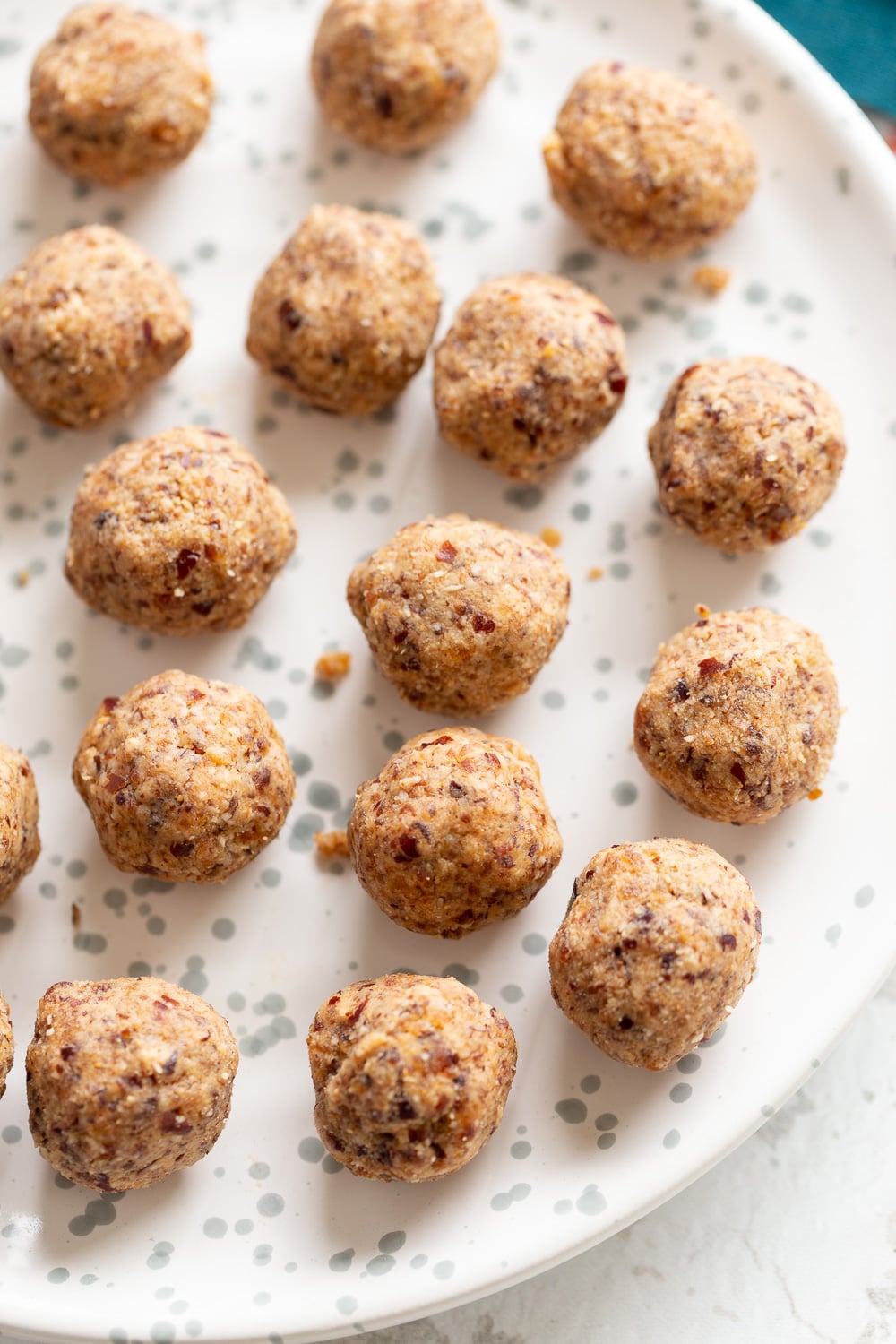 coconut balls overhead shot of a plate of vegan coconut balls