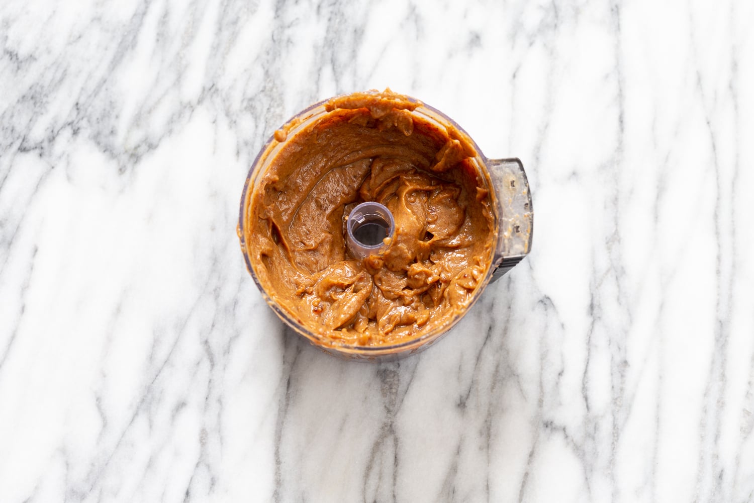 snickers recipe vegan date caramel in a food processor ready to be used as a filling for snickers