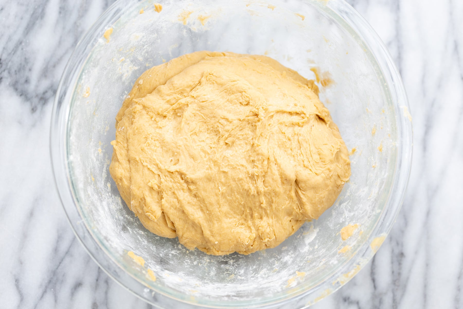 no yeast cinnamon rolls overhead shot no yeast cinnamon roll dough in glass bowl